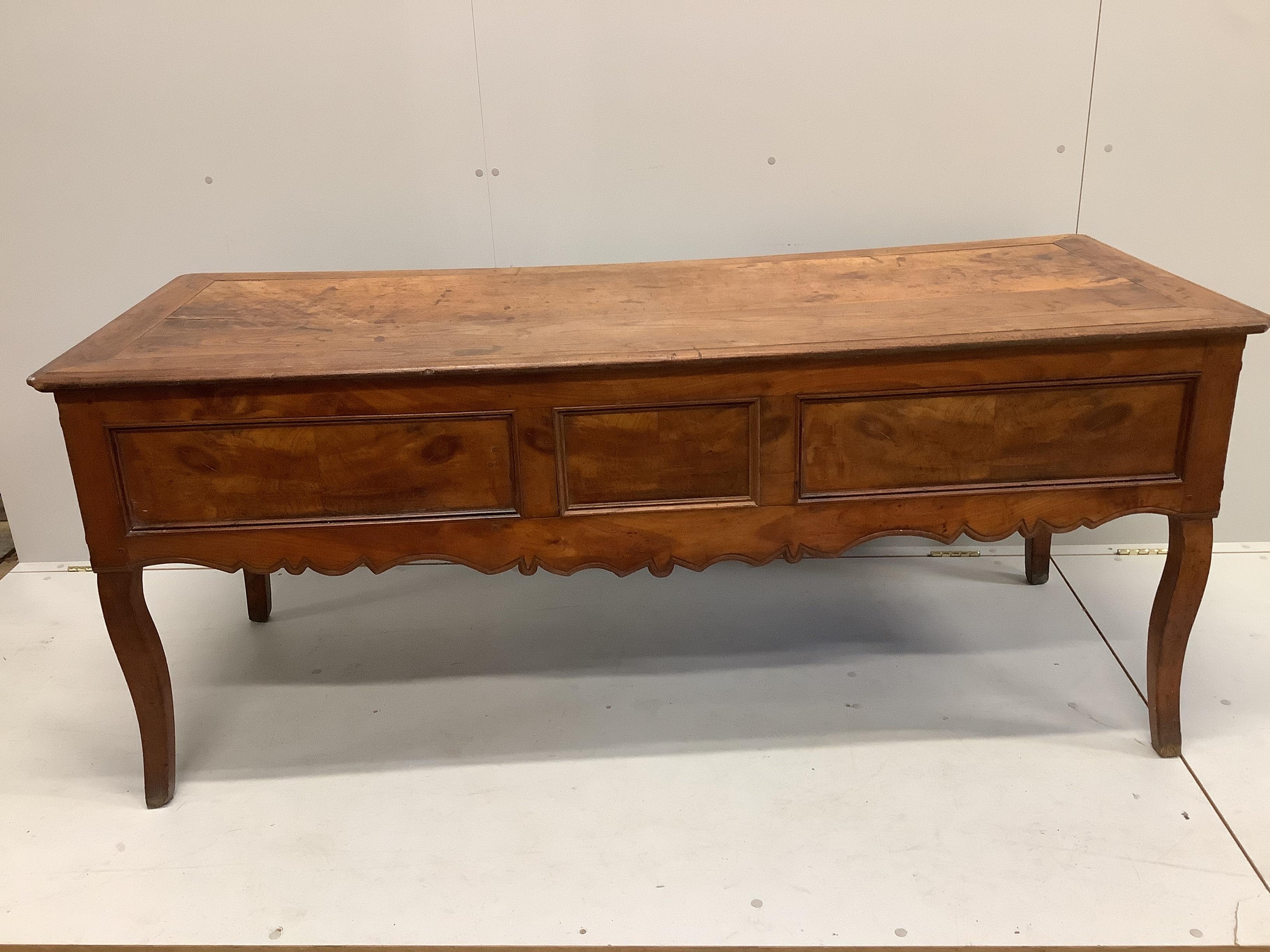 A late 18th century French Provincial fruitwood kneehole table, width 178cm, depth 70cm, height 74cm